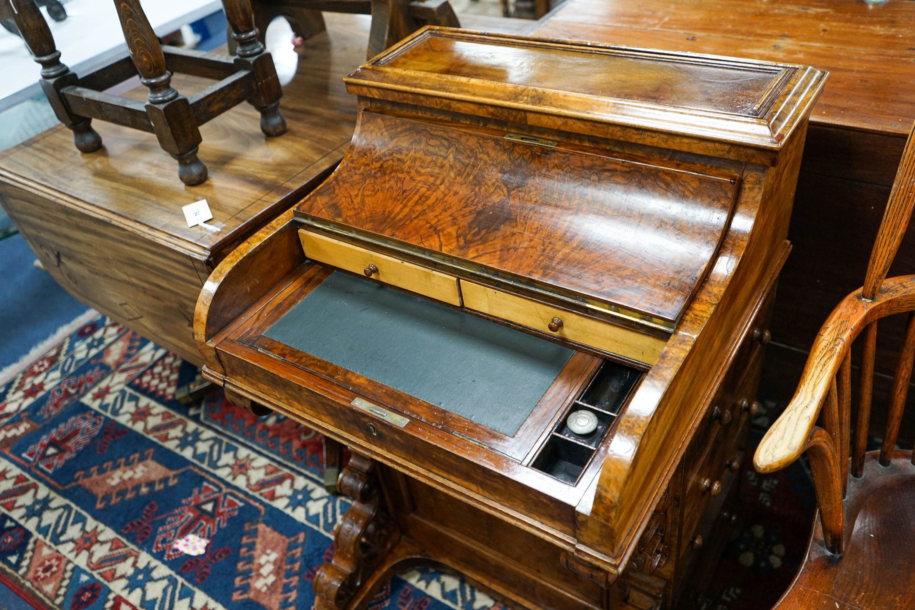 An Irish burr walnut piano top Davenport marked J J Byrne, 6 Henry Street, Dublin, width 56cm, depth 55cm, height 89cm